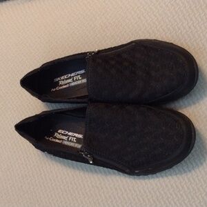 Skechers black zip Slip ons size 8.5